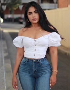 Maria Perez in tight blue jeans and white top