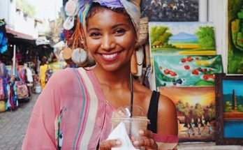 Rene Daniella standing in the street and smiling