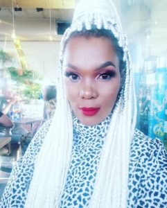 Mome Mahlangu in a white braid hair