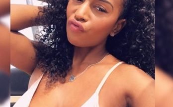 Shaun Necole with curly hair