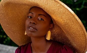 Paola Mathe wearing a large hat